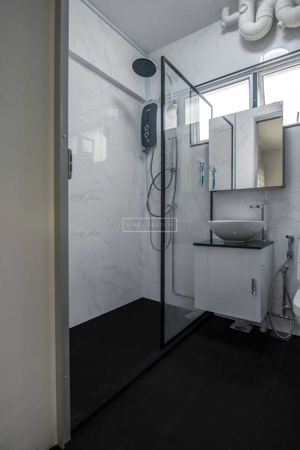 Scandinavian Bathroom with Granite Floor and Rainshower