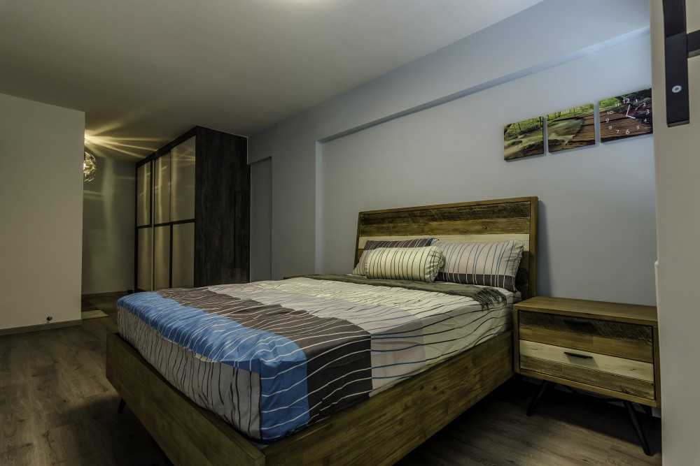 Industrial Bedroom with Vinyl Flooring and Wardrobe