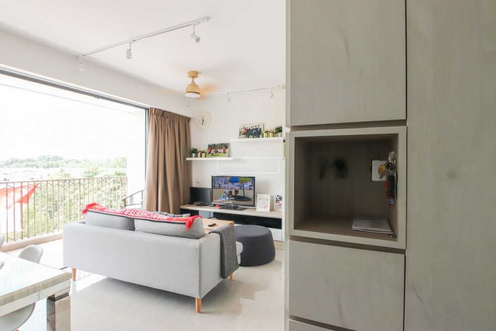 Scandinavian Living Room with Bookshelf and Feature Wall