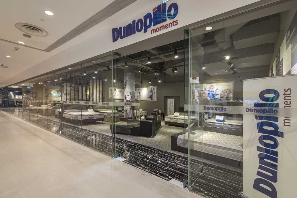 Industrial Shopfront with Homogeneous Tiles and Glass Door