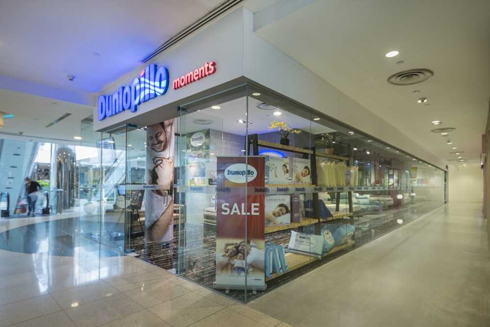 Industrial Shopfront with Homogeneous Tiles and Glass Door